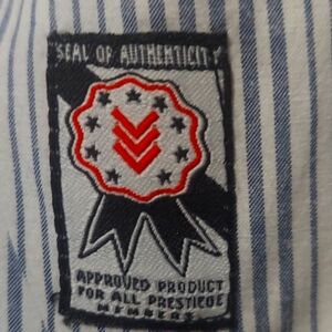 - High end designer. One 90 one mens button up